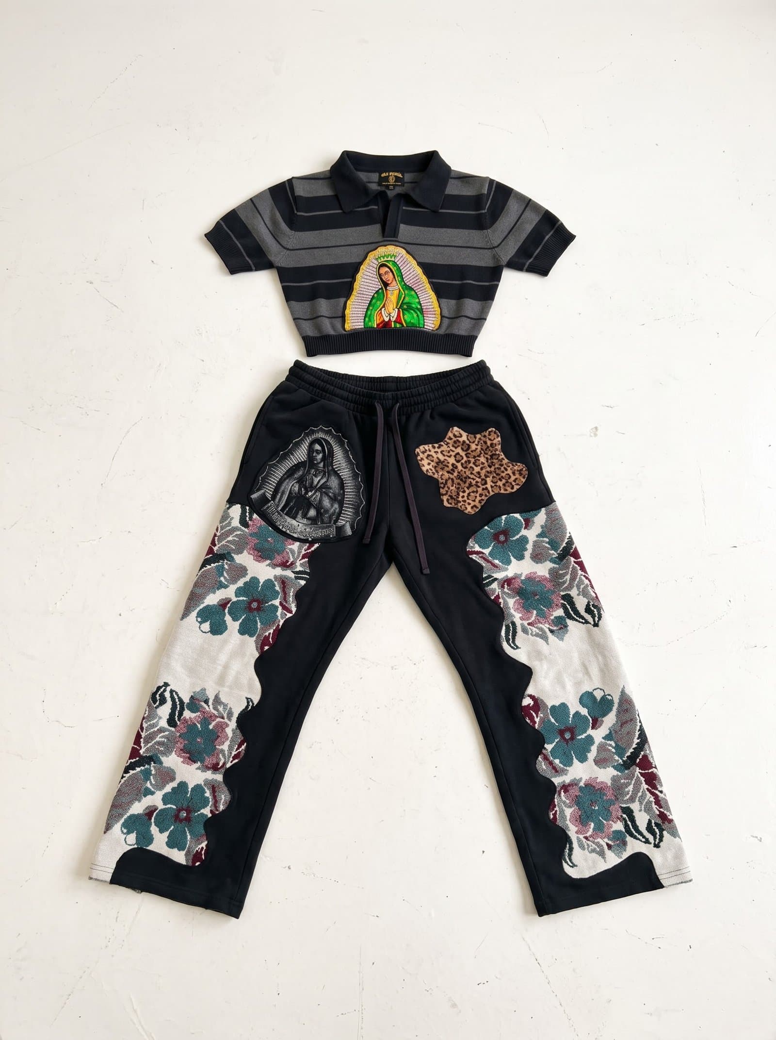 Front of the striped crop polo and floral tapestry trousers laid flat
